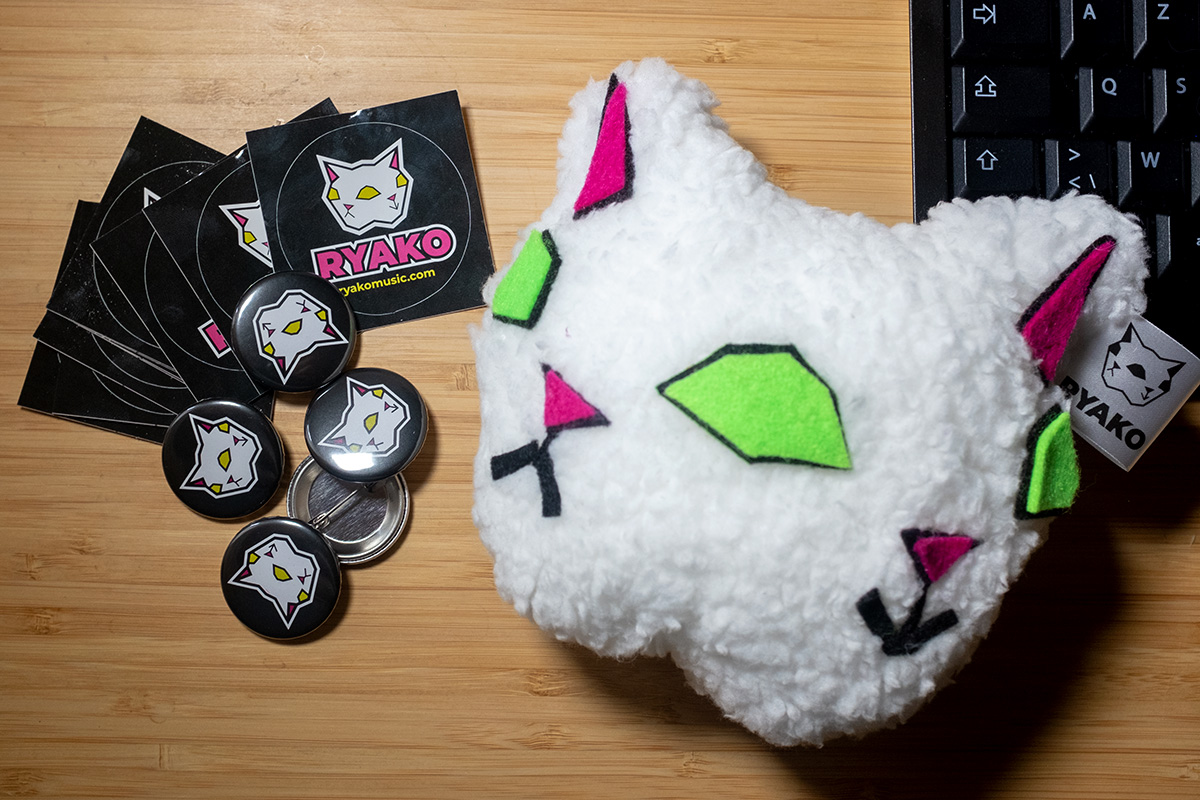 Buttons, stickers, and a plushie!  Oh my!